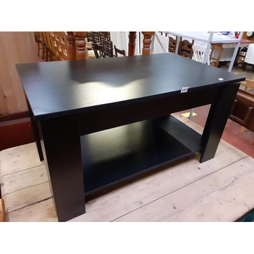 583 - Modern Black Ash Coffee Table with Sliding Top and Storage.