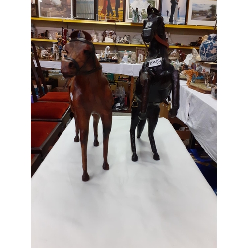 225A - Two Leather Clad Horse Figures - each approx 12