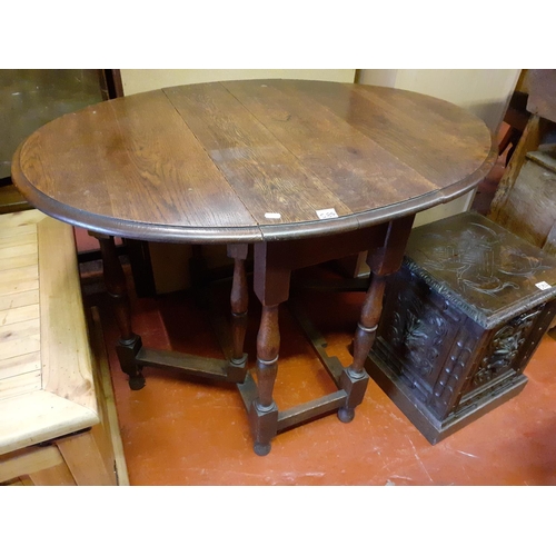 584 - Oval Oak Drop Leaf Table.