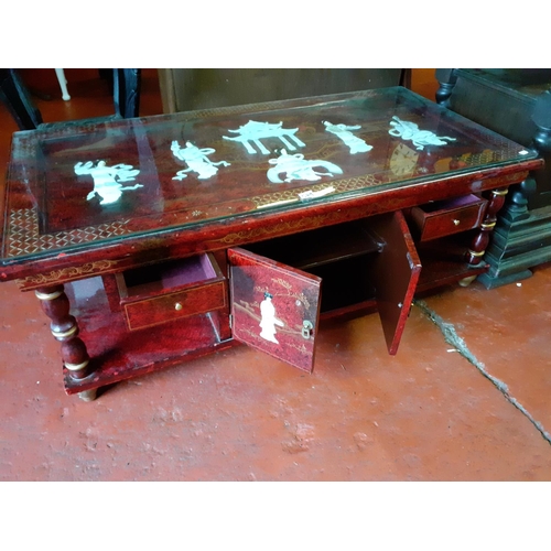 589 - Oriental Inlaid Coffee Table with Cupboard & Two Drawers, Red Lacquered Finish & Glass Top.