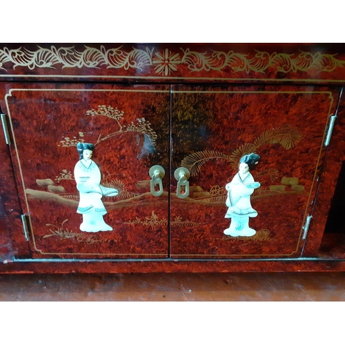 589 - Oriental Inlaid Coffee Table with Cupboard & Two Drawers, Red Lacquered Finish & Glass Top.