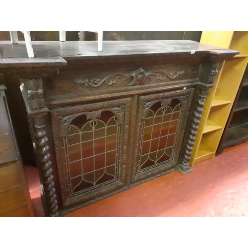 606 - Large Dark Oak Carved Unit, with Two Leaded Stained Glass Doors, Barley Twist Columns and Two Shelve... 