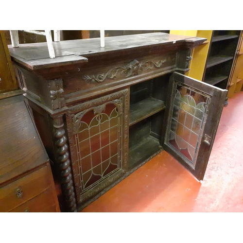 606 - Large Dark Oak Carved Unit, with Two Leaded Stained Glass Doors, Barley Twist Columns and Two Shelve... 