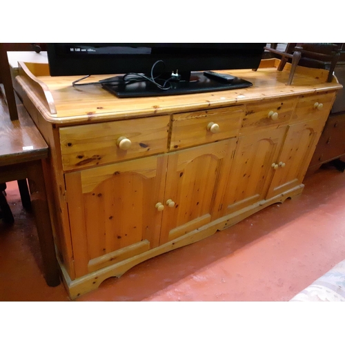 610 - Large Solid Pine Four Drawer, Four Cupboard Sideboard with Gallery Back & Sides.