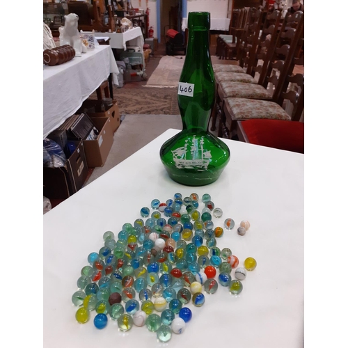 406 - Hand Decorated Bulbous Green Glass Bottle with Quantity of Marbles.