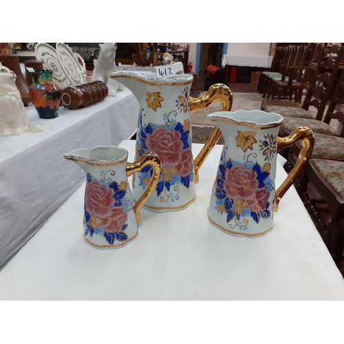 412 - Set of 3 Graduated Vintage Gilt Handled & Decorated Jugs.