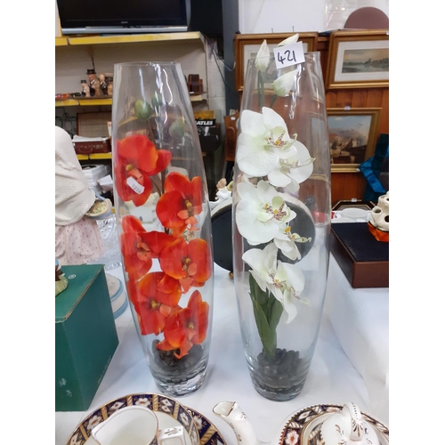 421 - Pair of Tall Glass Vases with Artificial Orchid Flowers.