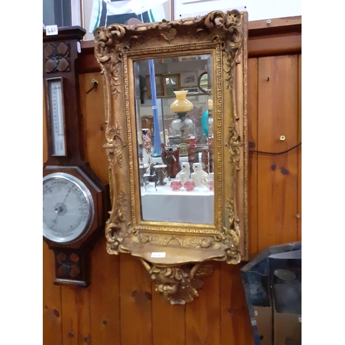 460 - Gilt Framed Wall Mirror with Cherub Detail Shelf.