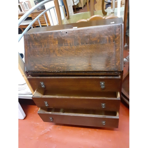 550 - Oak Drop Front Writing Bureau Over 3 Drawers.