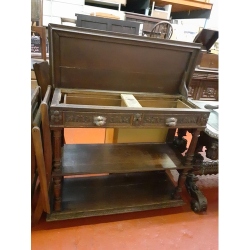 599 - 19th Century Carved Oak Three Tier Buffet with Two Drawers and Lift Top.