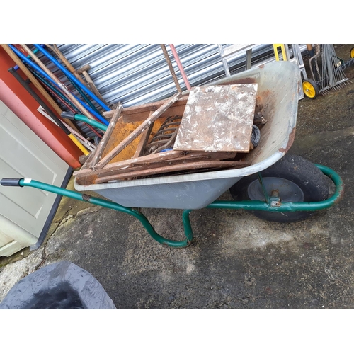 621 - Metal Garden Wheel Barrow & Contents to Include Wooden Step, Concrete Buddha, Tools etc.