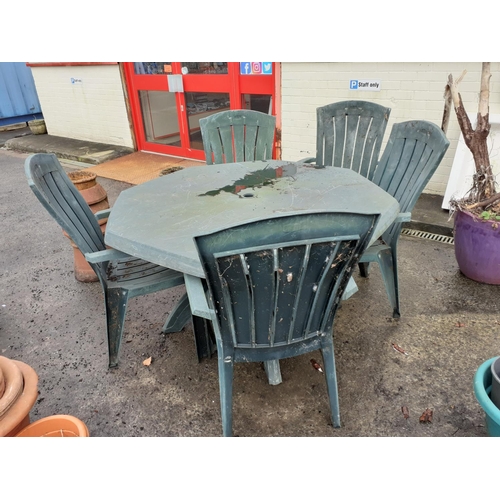 631 - Green Plastic Octagonal Patio Table with Five Matching Chairs.