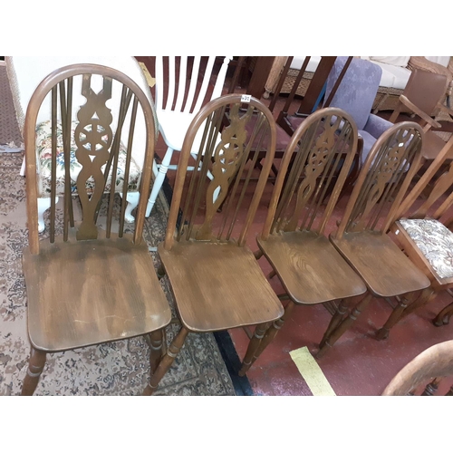 472 - Set of 4 Oak Spindle & Wheel Back Chairs.