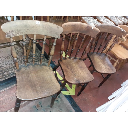 473 - Three Oak Spindle Back Chairs.