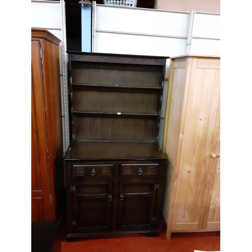 480 - Dark Oak Closed Back Double Dresser with Two Drawers over Two Cupboards.