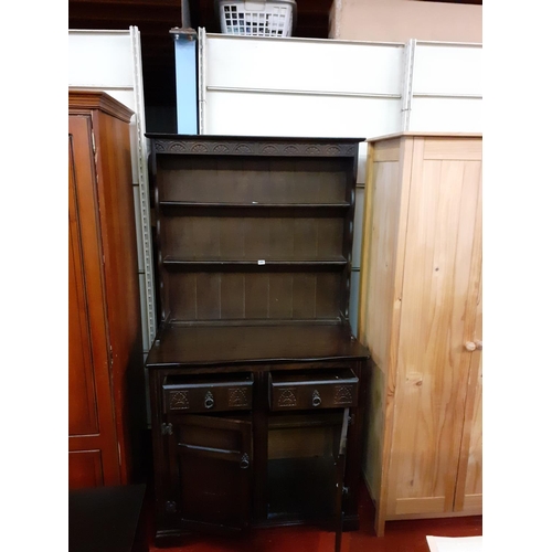 480 - Dark Oak Closed Back Double Dresser with Two Drawers over Two Cupboards.