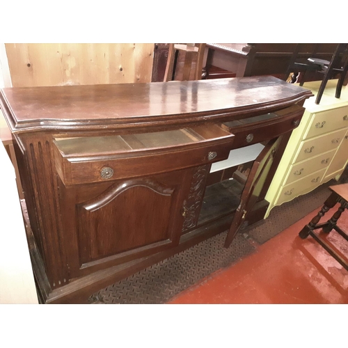 503 - Bow Fronted Oak Sideboard with 2 Drawers, Double Cupboard and Carved Central Panel.