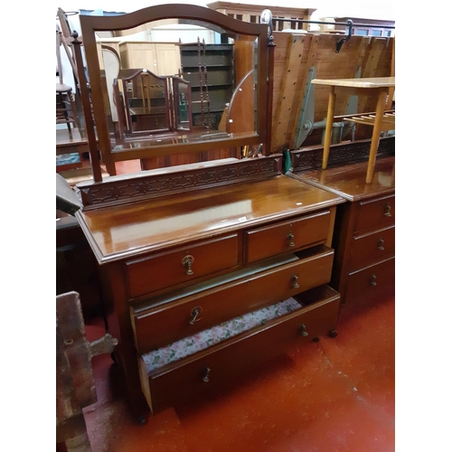 539 - 2 Over 2 Mahogany Chest of Drawers with Mirrored Top & Carved Back.