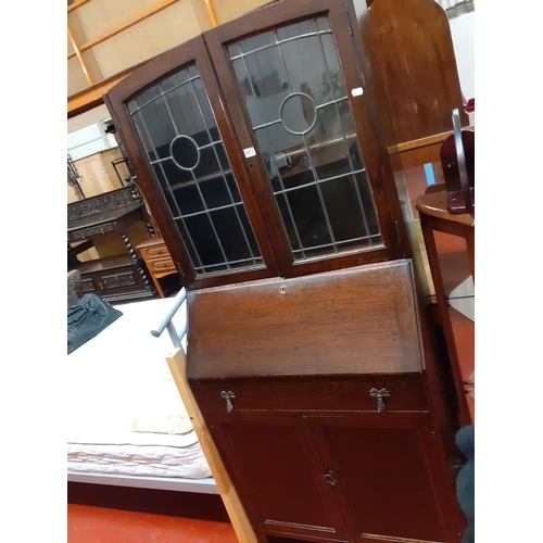 551 - Oak Glazed Top Bureau Bookcase with Drop Front Over Single Drawer and Double Cupboard.