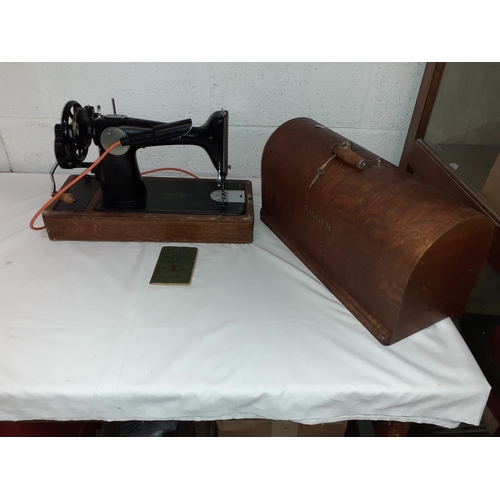 121 - Vintage Singer Sewing Machine in Oak Case with Electric Light, Original Instruction Book & Key.