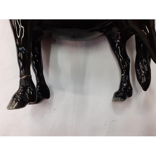 283 - Two Black Beswick Horses - both have repairs to legs.