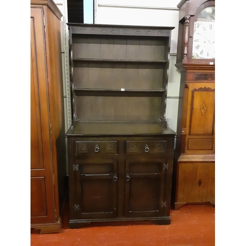 496 - Dark Oak Closed Back Double Dresser with Two Drawers over Two Cupboards.