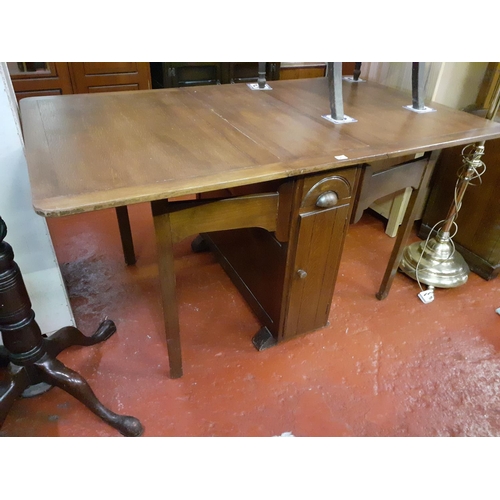 524 - Drop Leaf Oak Dining Table with Central Storage Drawer and Cupboard to Each Side.