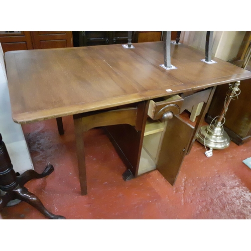 524 - Drop Leaf Oak Dining Table with Central Storage Drawer and Cupboard to Each Side.