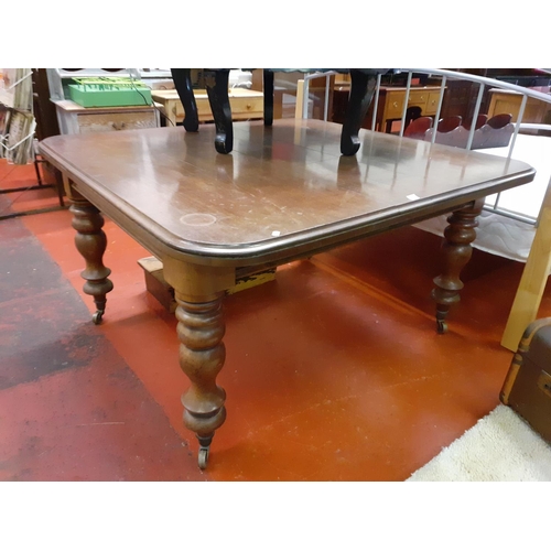 555 - Mahogany Wind Out Dining Table on Casters.