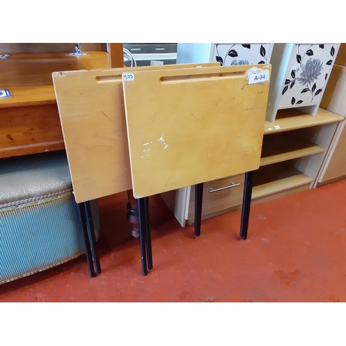 577 - Two Folding Wooden Topped, Metal Legged Exam Desks with Pen Trays.