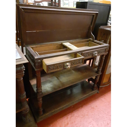 610 - 19th Century Carved Oak Three Tier Buffet with Two Drawers and Lift Top.