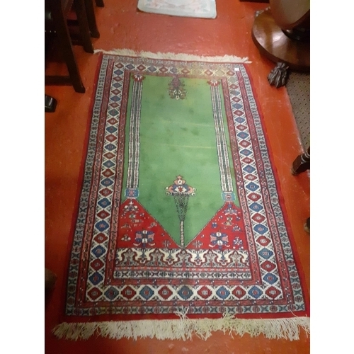 518 - Red & Green Floral Patterned Rug with Fringe Ends - 180cm x 104cm.