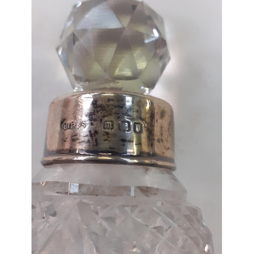 454 - Silver Hallmarked Rimmed Cut Glass Scent Bottle with Stopper.