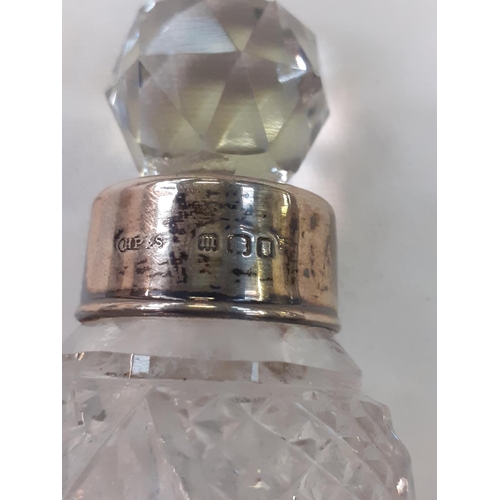 454 - Silver Hallmarked Rimmed Cut Glass Scent Bottle with Stopper.