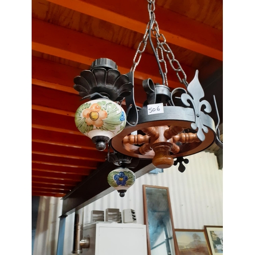 506 - Wooden Ships Wheel and Wrought Iron Three Branch Chandelier with Ceramic Bulb Holders.