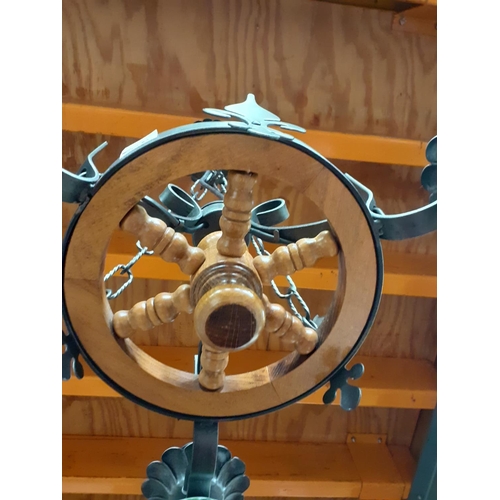 506 - Wooden Ships Wheel and Wrought Iron Three Branch Chandelier with Ceramic Bulb Holders.