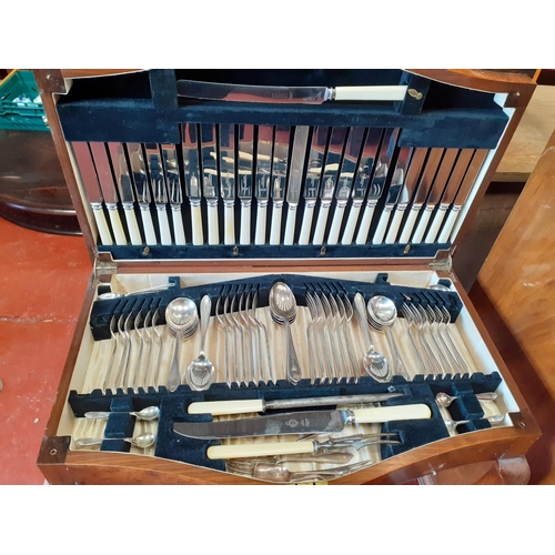 579 - Polished Walnut Canteen Table on Ball & Claw Feet with Full Cutlery Set.