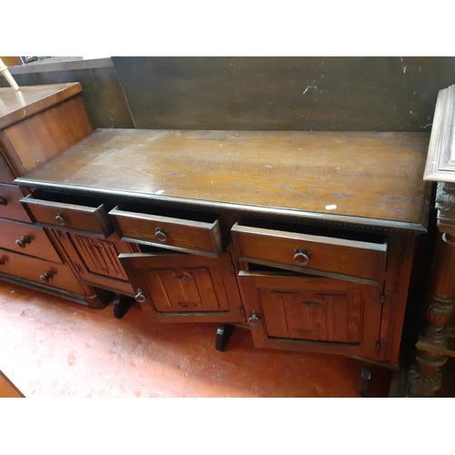 609 - Solid Dark Oak Three Drawer, Three Door Sideboard.