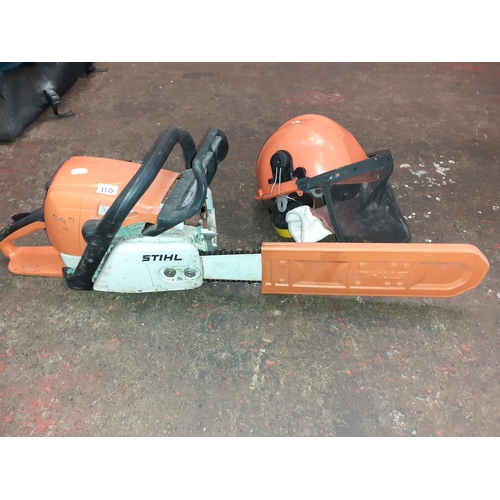 110 - Stihl Petrol Chainsaw with Safety Helmet & Ear Protectors - working.