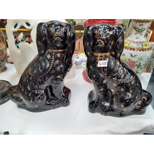 408 - Pair of Black & Gilt Staffordshire Spaniels.