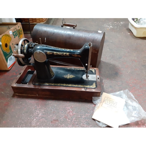 109 - Vintage Singer Sewing Machine in Oak Case.