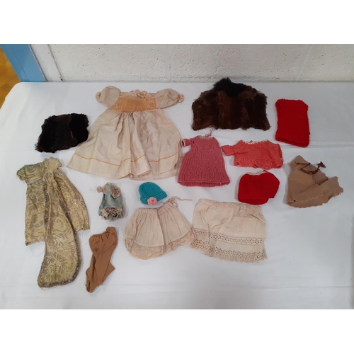 157 - Small Box of Assorted Dolls Clothes.