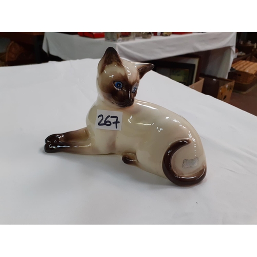 267 - Beswick Siamese Cat Laying Down - No 1558 - tiny chip to tip of one ear.