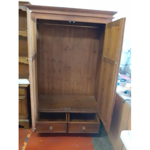 633 - Solid Pine Double Wardrobe with Twin Drawers.