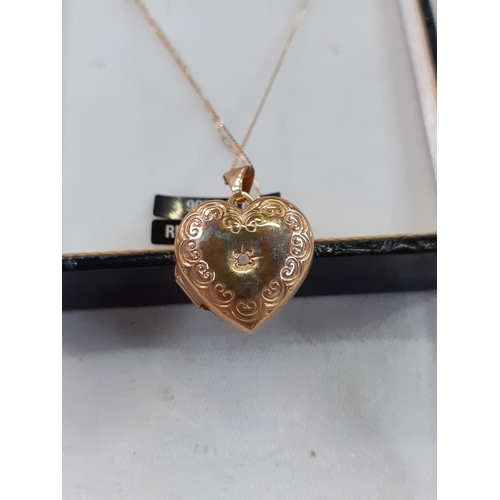 423 - 9ct Gold Heart Locket on Chain with Diamond Chip.