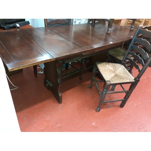 550 - Oak Drawer Leaf Table with Four Cord Seated Chairs & A Matching Carver Chair.