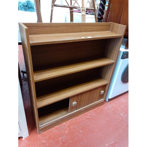 569 - Three Shelf Oak Effect Finish Bookcase with Double Sliding Door Cupboard Under.