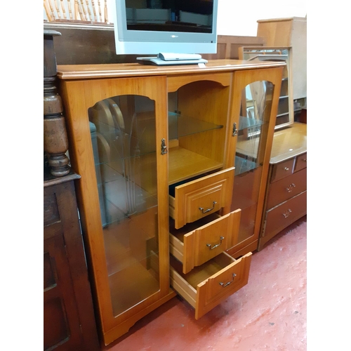 594 - Modern Pine Effect Side by Side Display Cabinet with Three Central Drawers and Glass Shelf Flanked b... 