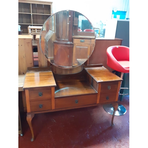 613 - Mahogany Five Drawer Dressing Table with Single Circular Mirror Back.