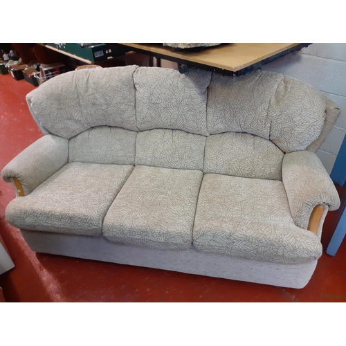 630 - Upholstered Natural Coloured Three Seater Settee.